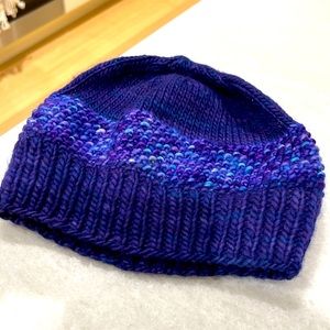 Knitted purple winter hat for kids